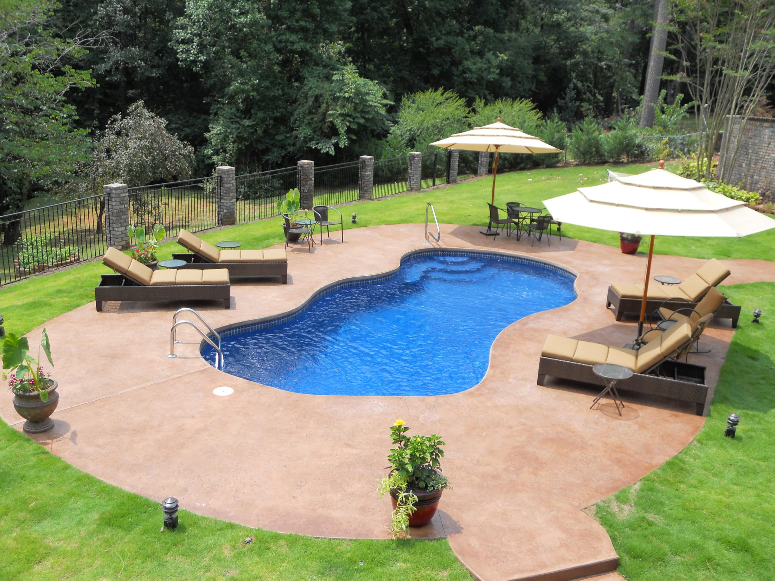 Bay-Isle-1a-scaled curvy style inground fiberglass pool with side walk-in steps