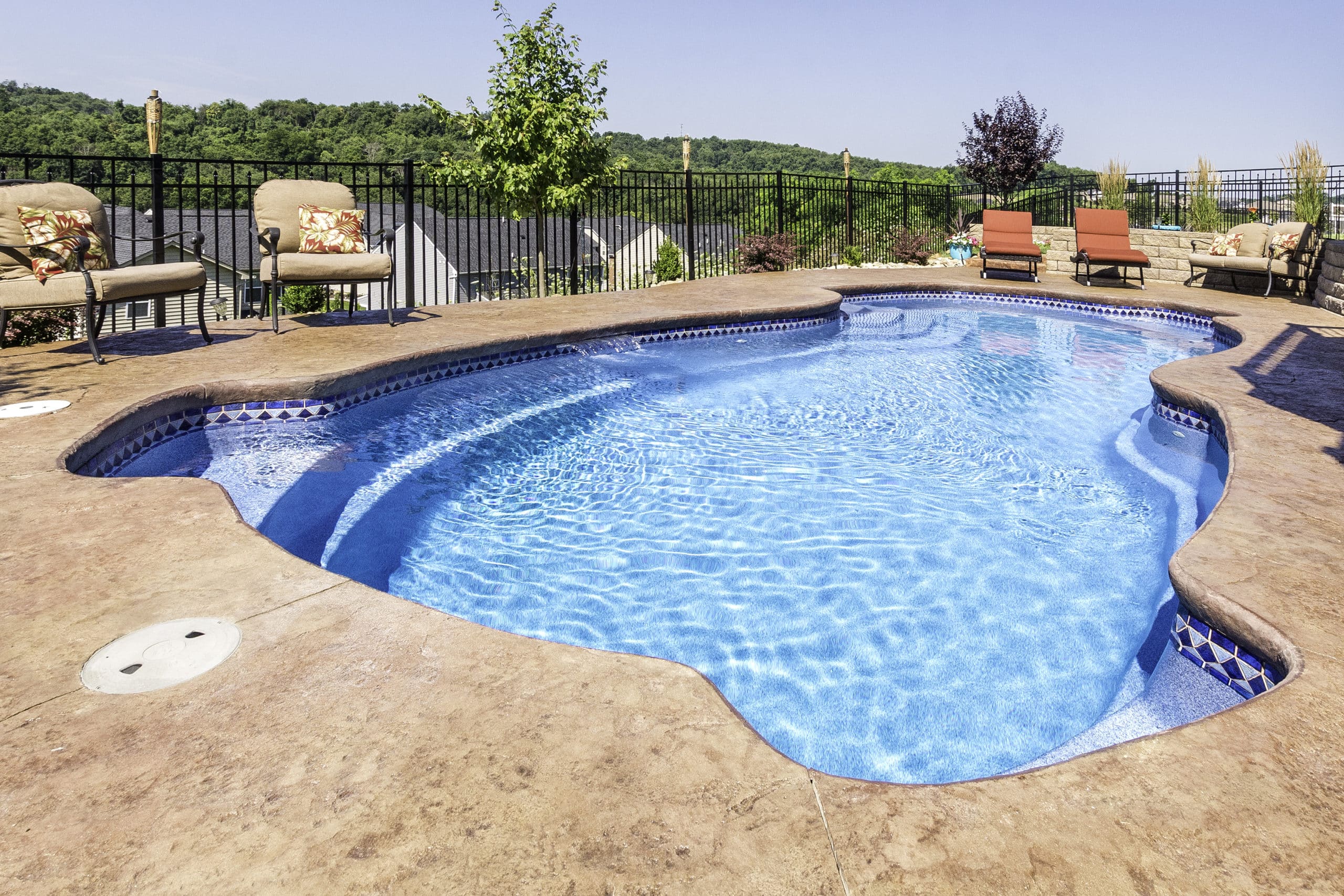 Viking-322_Braeburn-11-Rockport-scaled curvy inground fiberglass pool with multiple walkin step areas at each corner