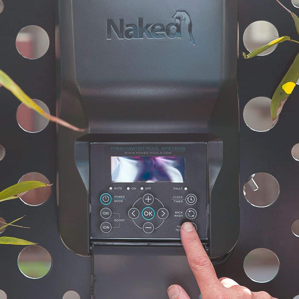 A finger presses a button on the Naked control unit display